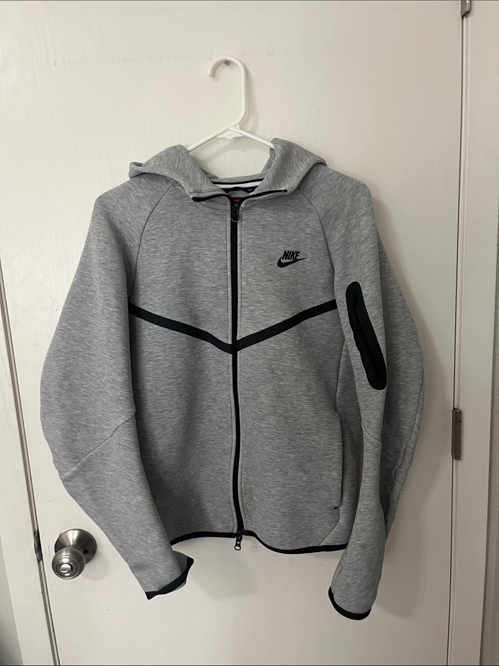 Nike tech zip up gray men’s small

2 stains which are shown in photos.